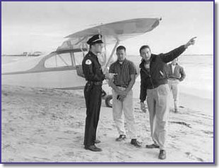 Barry on the beach after an engine failure engine with a student